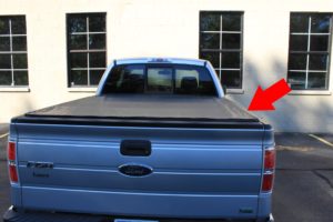 A Ford F-150 pickup truck with a tonneau cover
